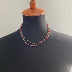 Two choker necklaces, red and brown